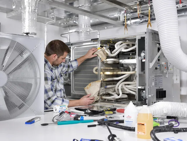 Winchester Air Duct Cleaning specialist performing precision AC coil cleaning in Winchester
