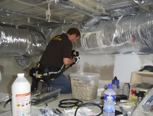 Winchester Air Duct Cleaning specialist performing professional mold removal from air ducts in Winchester