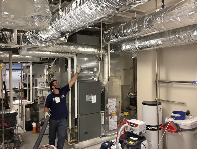Winchester Air Duct Cleaning specialist performing thorough furnace duct cleaning in a Winchester residence