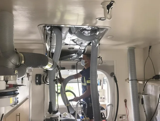 Winchester Air Duct Cleaning specialist performing precise mobile home duct cleaning in Winchester