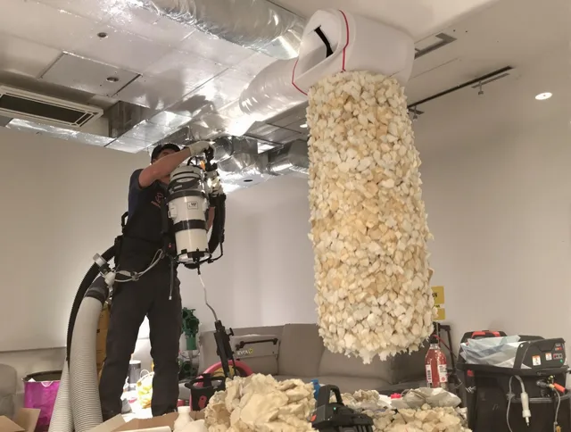 Winchester Air Duct Cleaning technician performing precision vacuum insulation removal in a residential property in Winchester